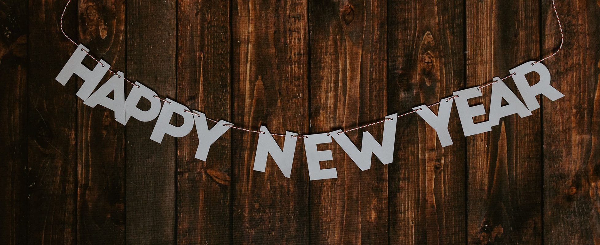 happy new year banner on wood background