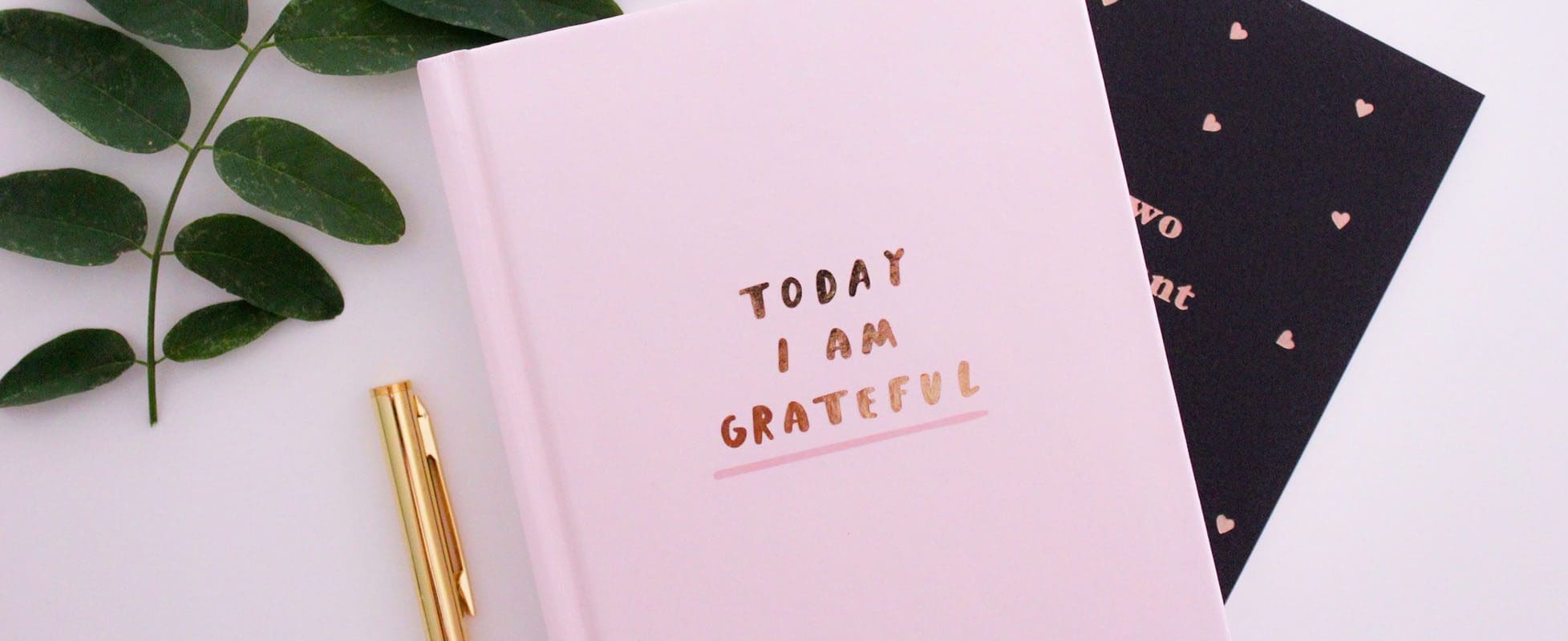 notebook with grateful quote on cover