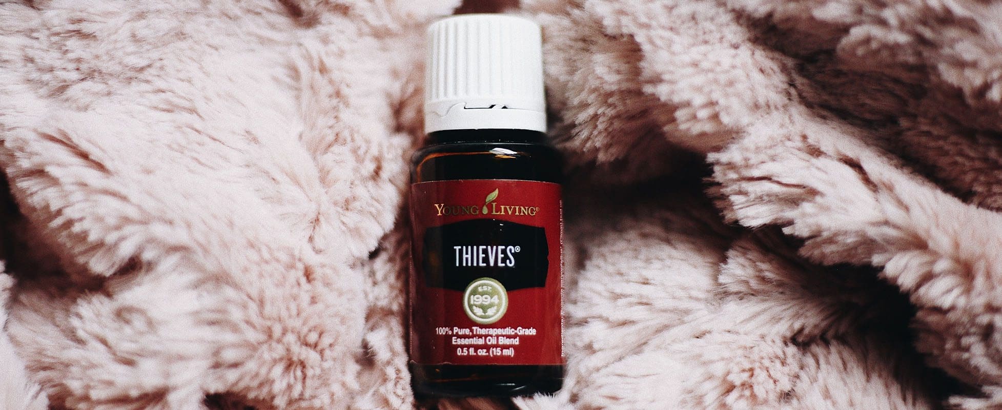 thieves essential oil on cozy blanket